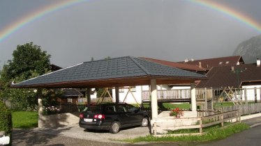 Haus Strigl unterm Regenbogen