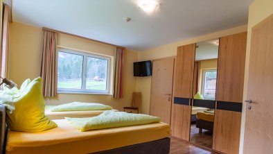 Schlafzimmer mit flexiblen Boxspringbetten Apartments Egger Tux